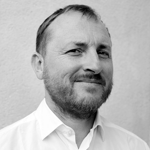 Headshot of Adrian Philpott in black and white
