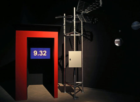 Installation photo of red frame, number display and construction