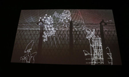 image of black and white animation on a screen of women and a wire fence