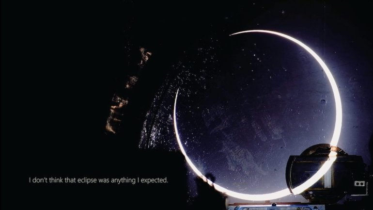 solar eclipse overlaid on night sky with text